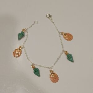 Elegant Silver Bracelet with Green Conch Shells and Pink Clamshell Charms